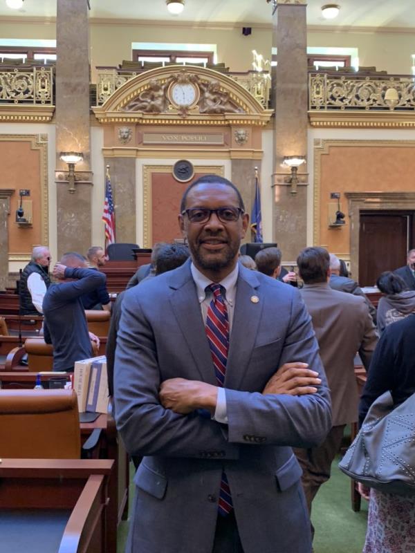 A photo of Vernon Jordan with his arms crossed.