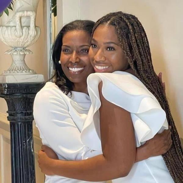 A photo of Joycelyn Wade and her daughter embracing.