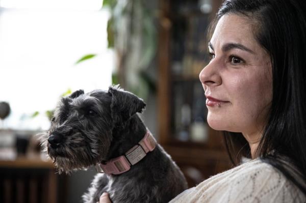 A photo of Dr. Pardo with her miniature schnauzer, Lily.