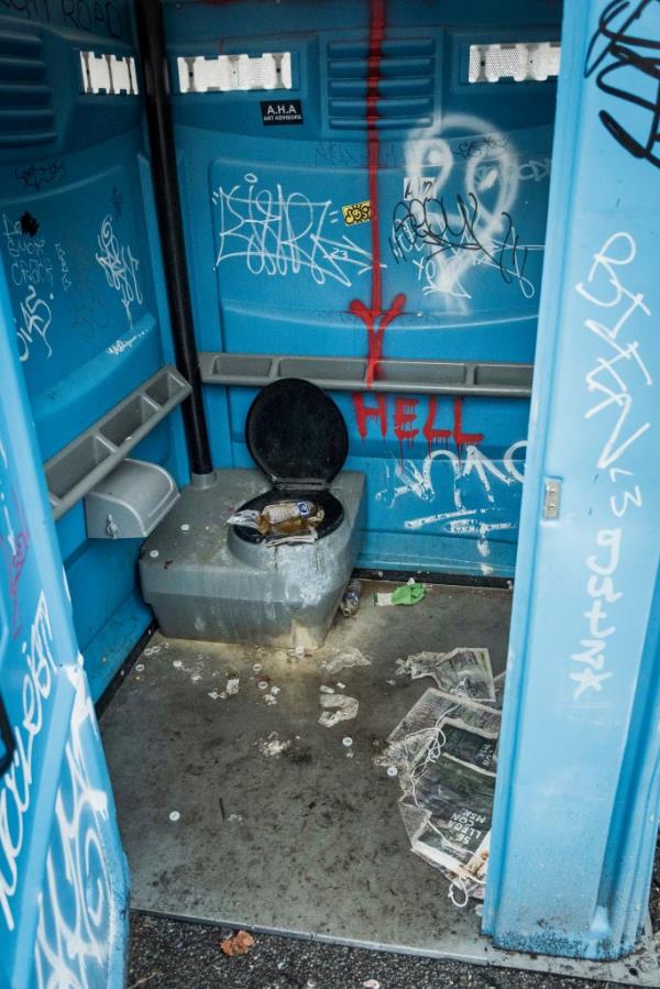 The interior of a port-a-potty at Tompkins Square Park that had been vandalized.