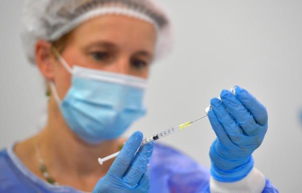 A nurse draws a dose of the Bio<em></em>ntech vaccine against coro<em></em>navirus disease (COVID-19) at a vaccination centre at the Dresden Fair, in Dresden, Germany, July 29, 2021.