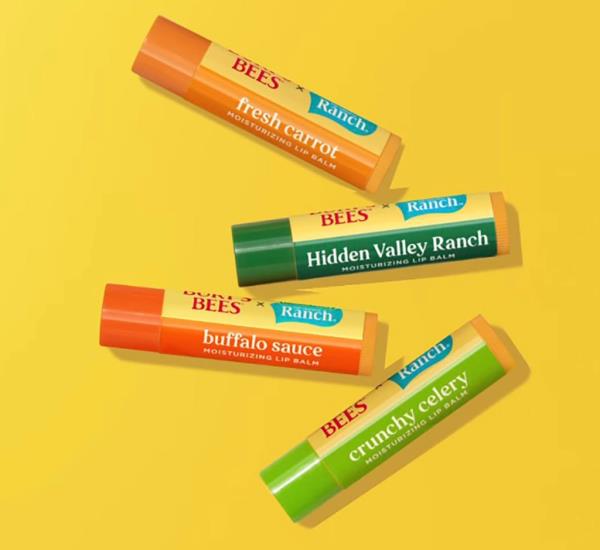 Close-up shot of the four flavored lip balms: fresh carrot, Hidden Valley ranch, buffalo sauce and crunchy celery.