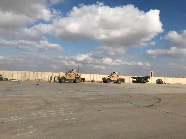 Military vehicles outside of the Ain al-Asad airba<em></em>se